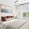 bedroom with white dresser and ceiling fan
