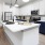 a kitchen with white cabinets