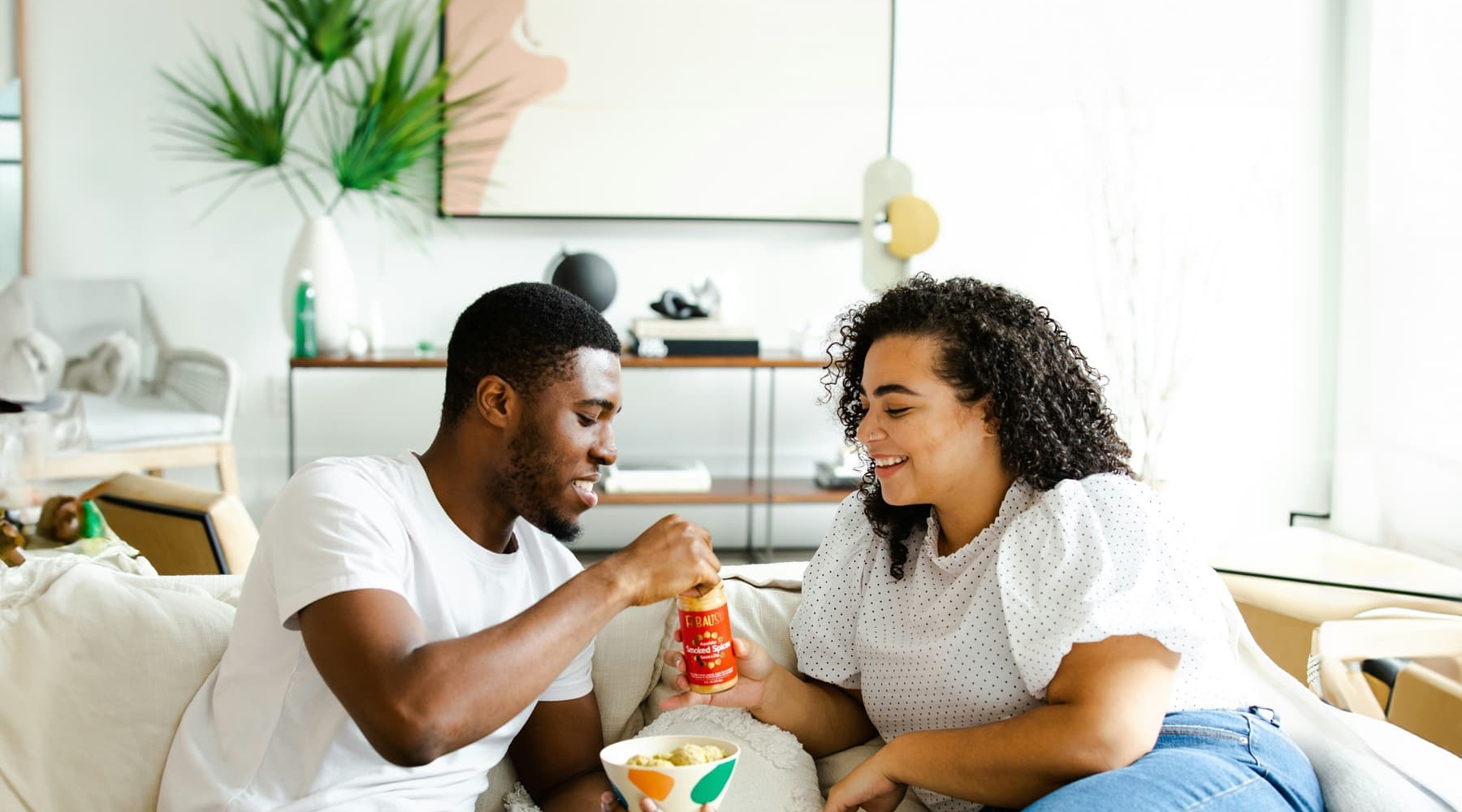 a couple embracing and enjoying popcorn
